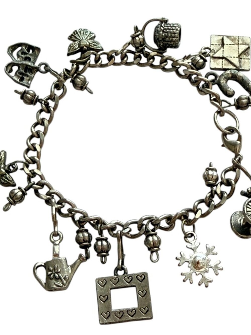 Vintage Multi-Charm Bracelet A stylish vintage bracelet featuring